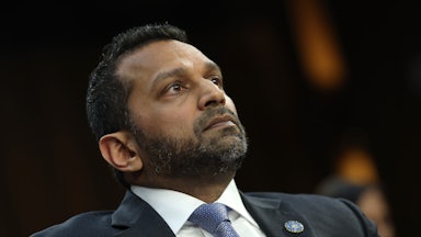 FBI Director Kash Patel leans back while sitting in a Senate hearing