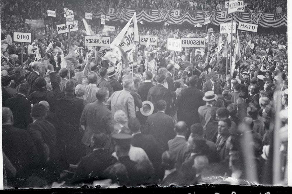 Protesters with signs denouncing the Ku Klux Klan congregate at the 1924 Democratic National Convention.