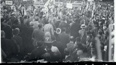 Protesters with signs denouncing the Ku Klux Klan congregate at the 1924 Democratic National Convention.