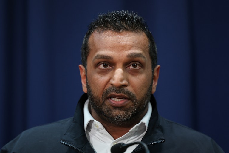 FBI Director Kash Patel looks up while speaking during a press conference