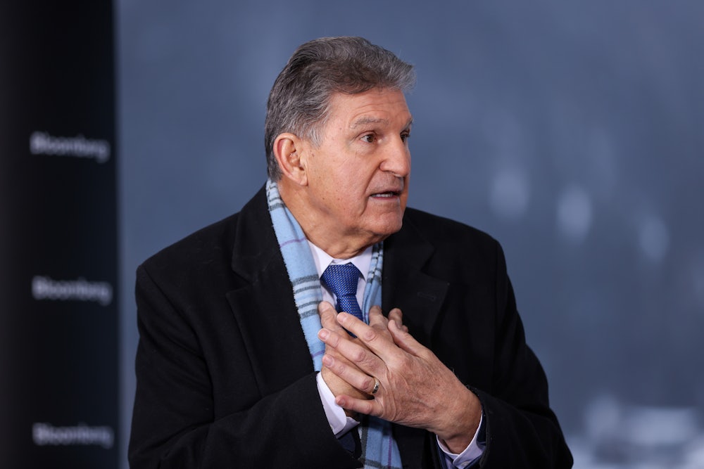 Senator Joe Manchin speaks while gesticulating.