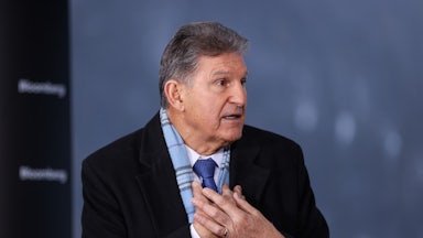 Senator Joe Manchin speaks while gesticulating.