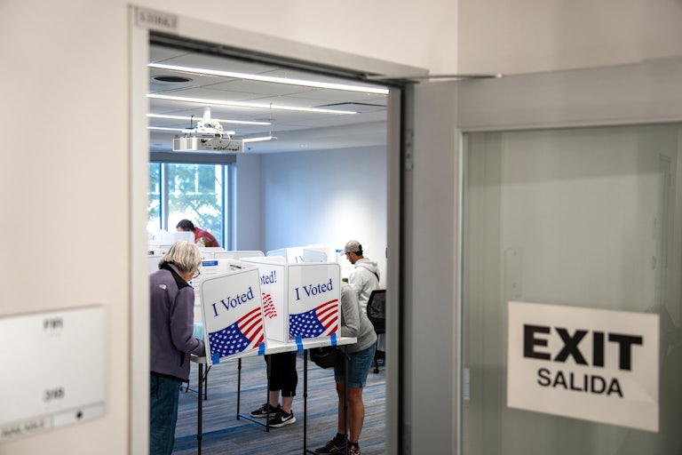 People vote at a polling station
