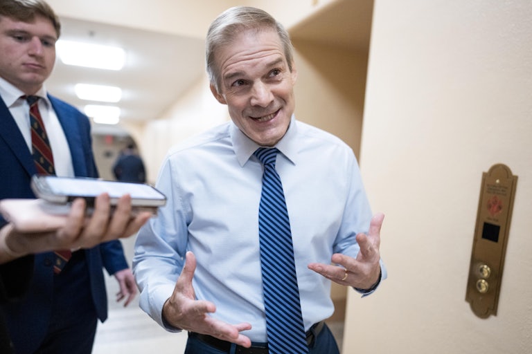 Jim Jordan gestures while speaking to reporters in the Capitol