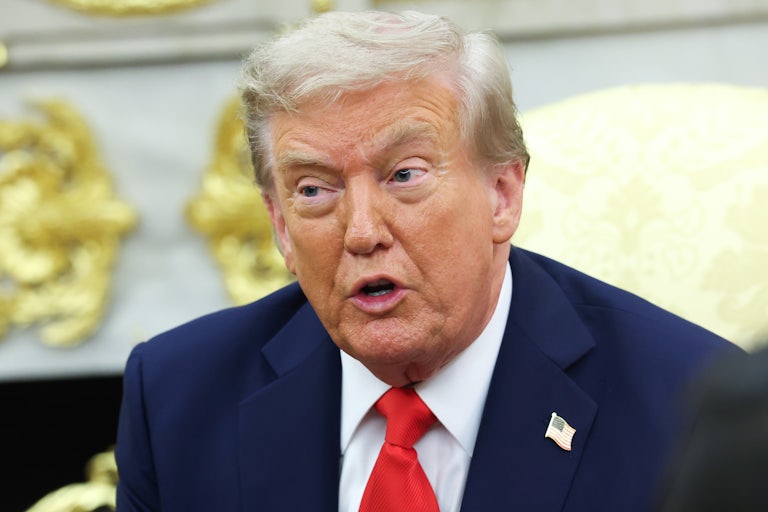 Donald Trump speaks while sitting in the Oval Office