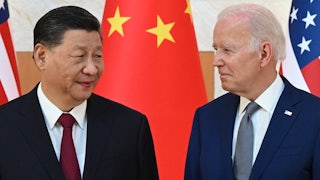 Xi Jinping and Joe Biden look at one another.