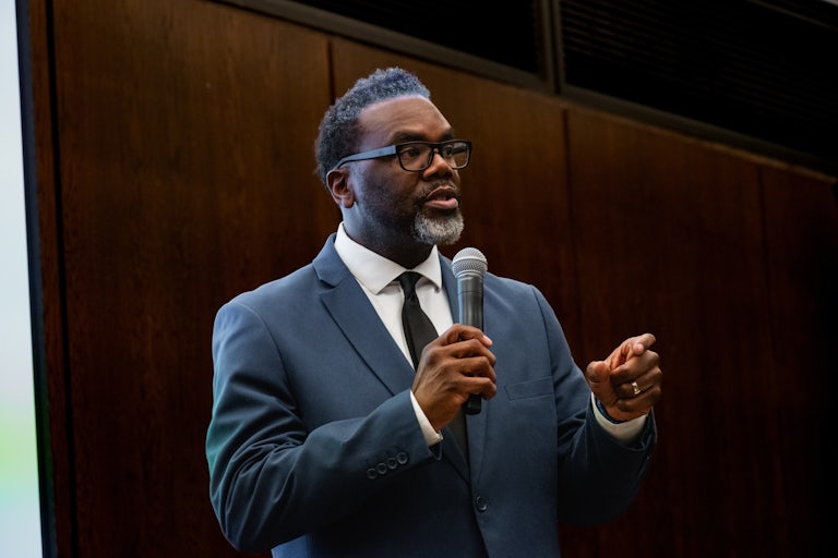 Chicago mayoral candidate Brandon Johonson speaks holding a mic