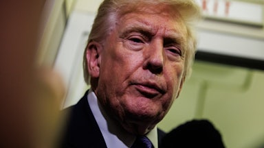 Donald Trump speaks to reporters on Air Force One