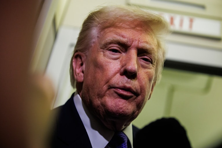 Donald Trump speaks to reporters on Air Force One