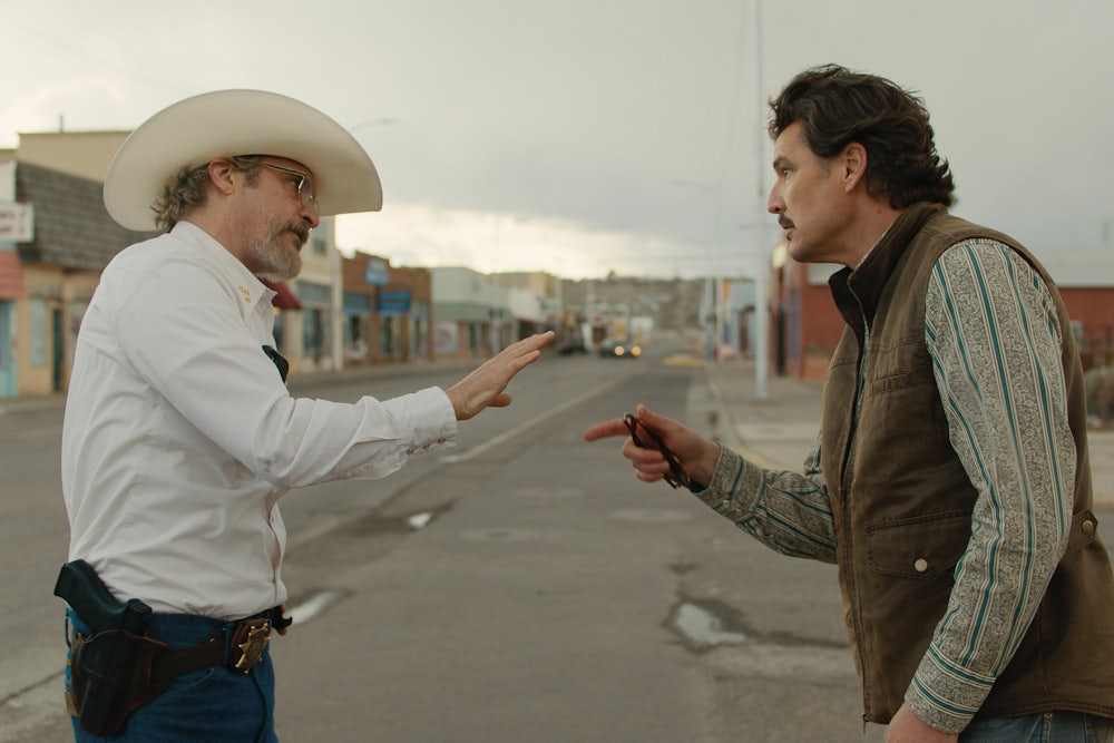 Joaquin Phoenix (left) and Pedro Pascal in “Eddington.”