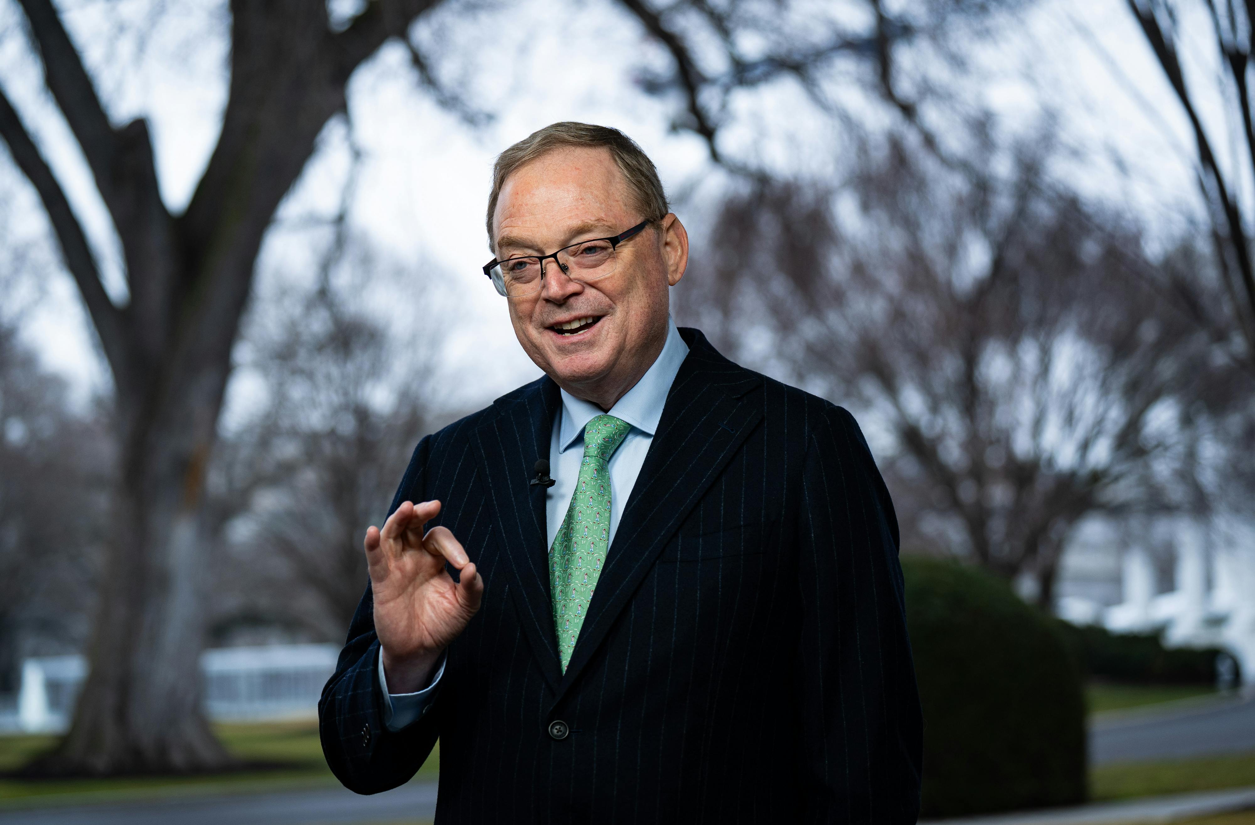 Kevin Hassett, director of the National Economic Council, speaks during an interview outside the White House, and makes an OK gesture with his hand.