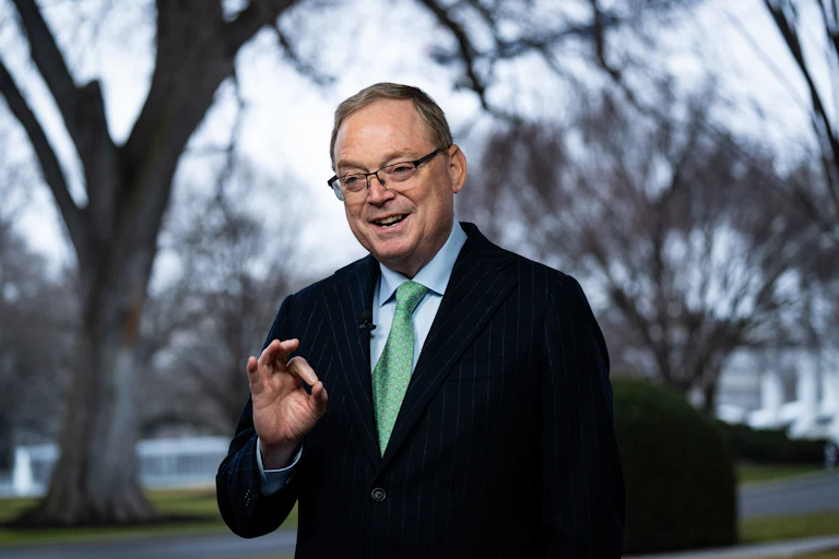 Kevin Hassett, director of the National Economic Council, speaks during an interview outside the White House, and makes an OK gesture with his hand.