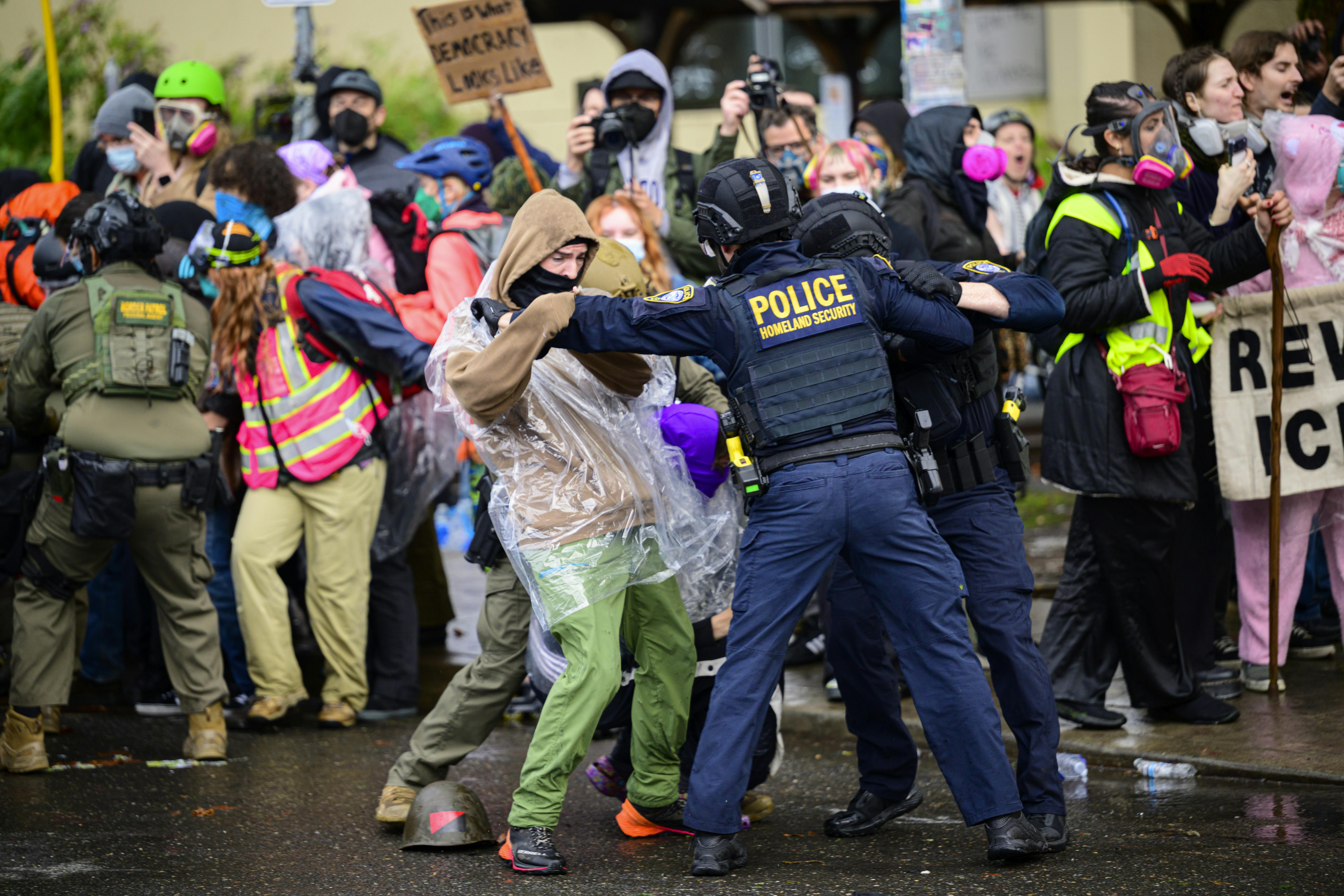 Federal agents clash with protesters outside an ICE facility in Portland, Oregon.
