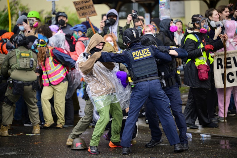 Federal agents clash with protesters outside an ICE facility in Portland, Oregon.