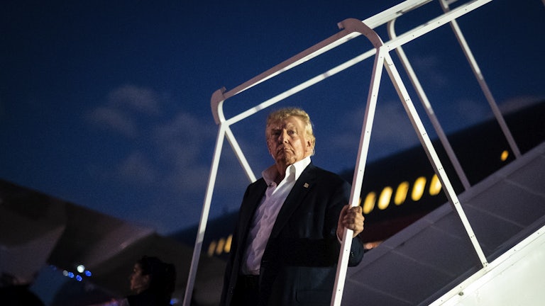 Trump disembarks his airplane 