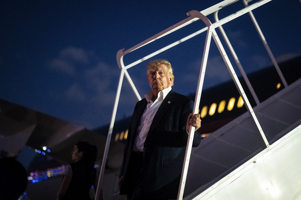 Trump disembarks his airplane