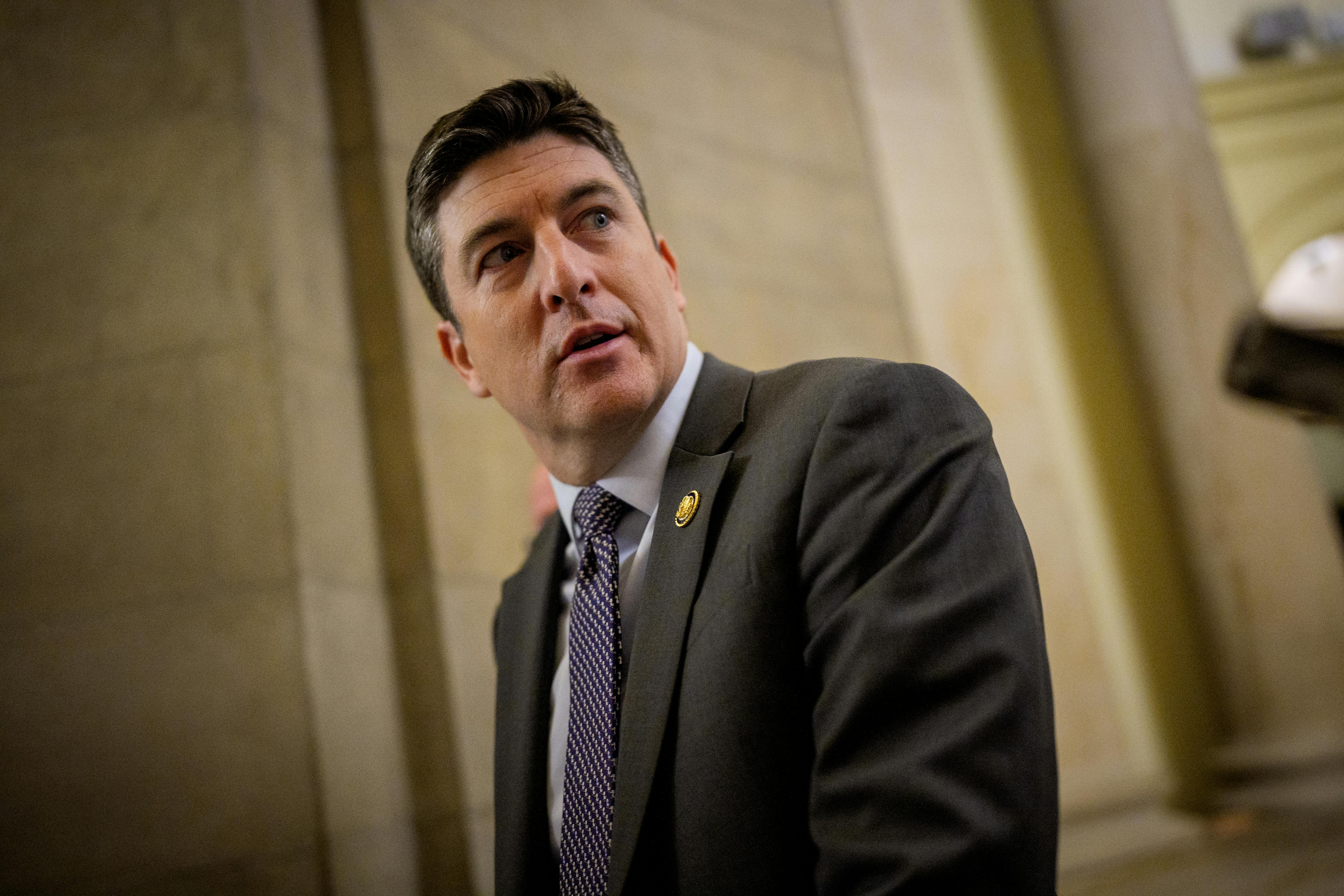 Representative Bryan Steil looks over his shoulder in the Capitol.