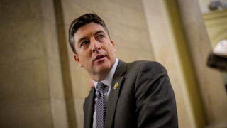 Representative Bryan Steil looks over his shoulder in the Capitol.