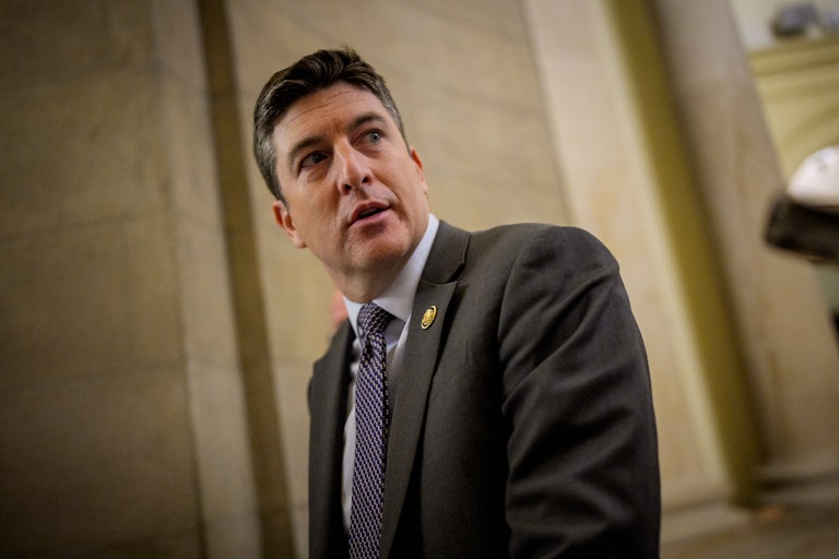 Representative Bryan Steil looks over his shoulder in the Capitol.