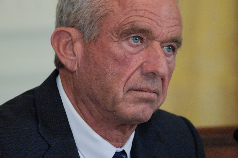 Robert F. Kennedy Jr. sits in the White House during a press conference