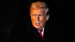 Donald Trump looks to his right side, appearing angry