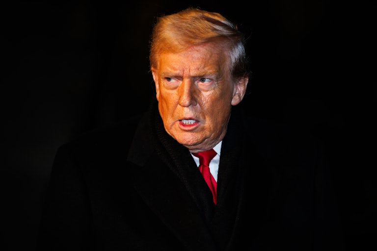 Donald Trump looks to his right side, appearing angry