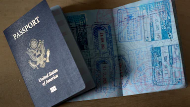 U.S. passports, one open with stamps and one closed
