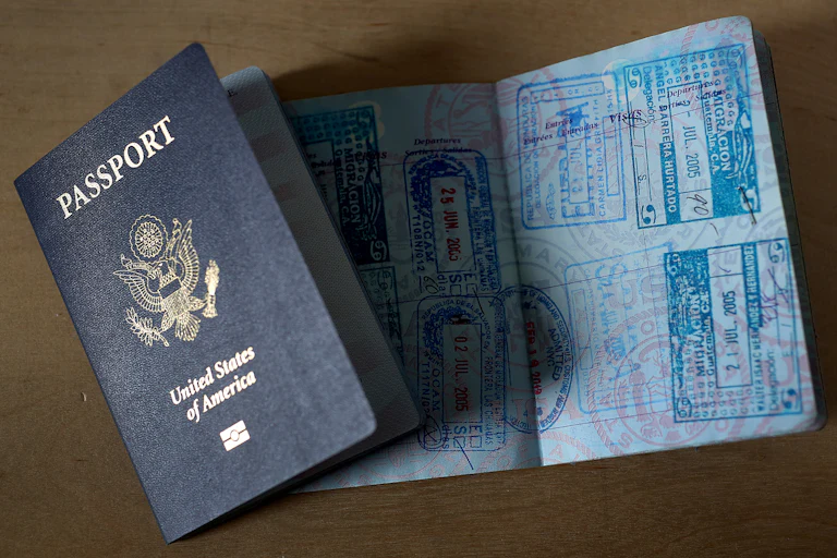 U.S. passports, one open with stamps and one closed