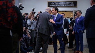 Senate Minority Leader Chuck Schumer and Secretary of State Marco Rubio speak while surrounded by reporters