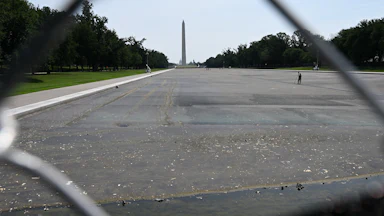 The Reflecting Pool, seen through a chain-link fence