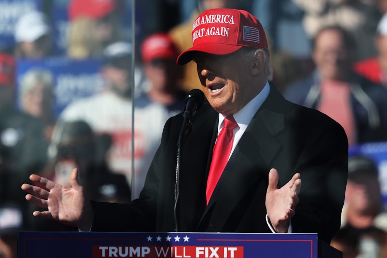 Donald Trump gestures while speaking on stage at a rally in Lititz, Pennsylvania
