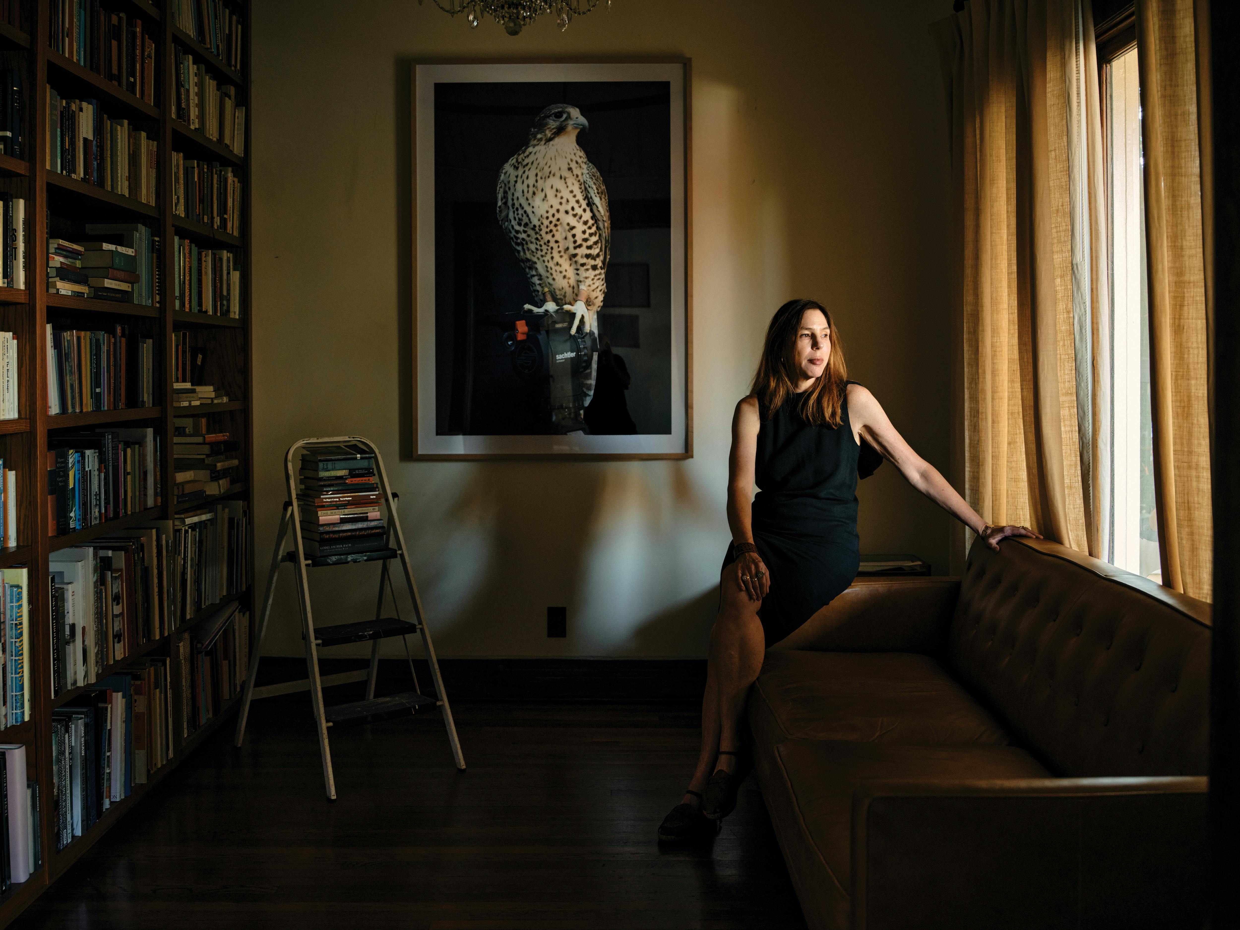 Author Rachel Kushner rests on her sofa at home. 