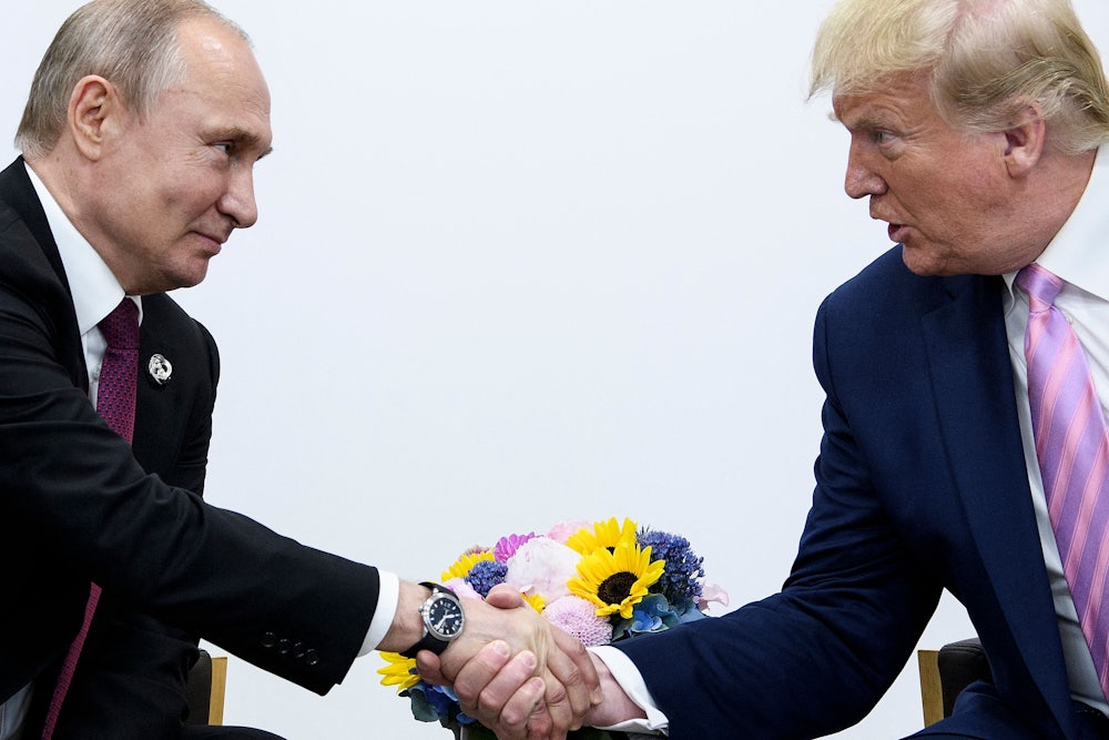 Donald Trump shakes hands with Russian President Vladimir Putin during the G20 summit in 2019.