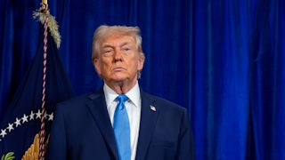 Donald Trump standing and frowning