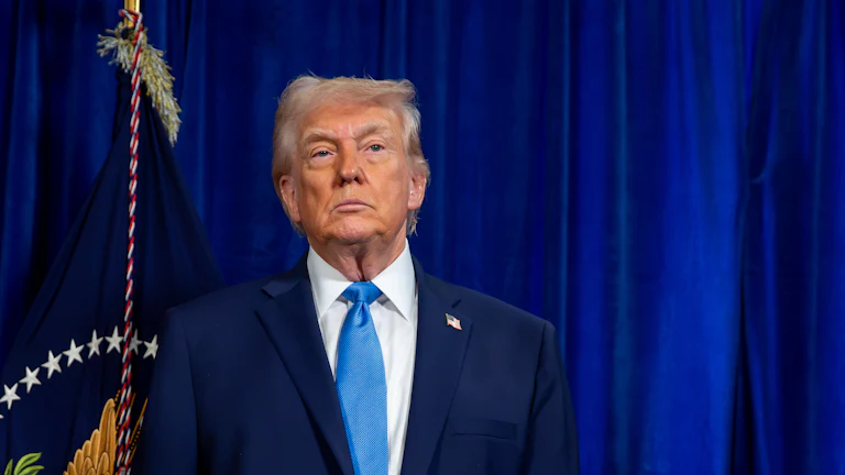 Donald Trump standing and frowning