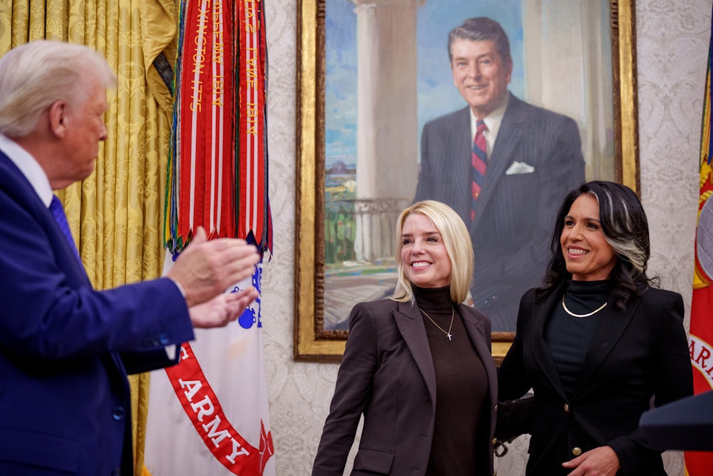 President Donald Trump applauded after Tulsi Gabbard was sworn in as the director of national intelligence by Pam Bondi, the attorney general, on February 12.
