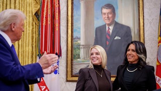 President Donald Trump applauded after Tulsi Gabbard was sworn in as the director of national intelligence by Pam Bondi, the attorney general, on February 12.
