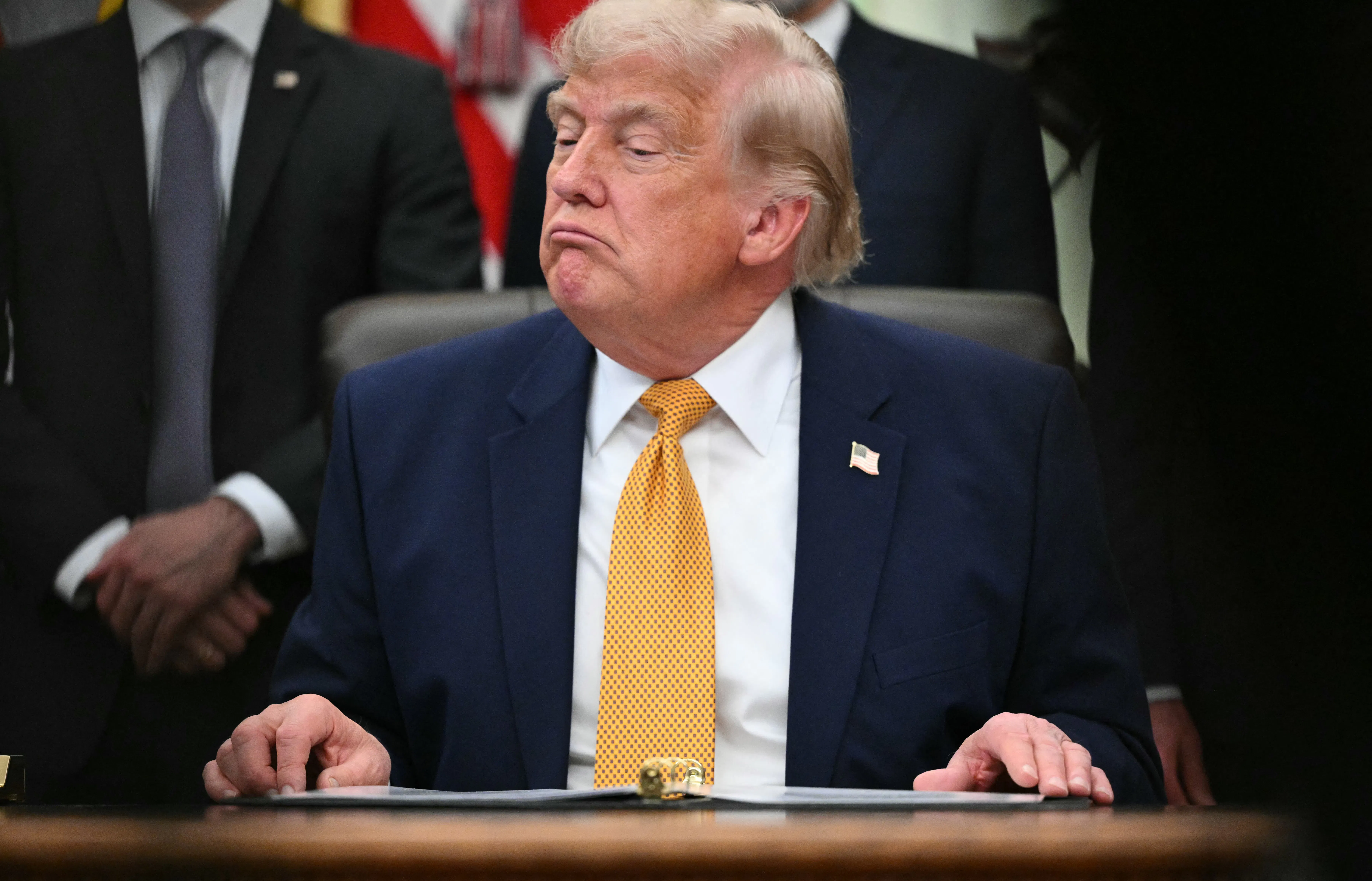 Donald Trump frowns petulantly