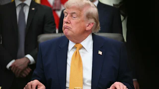 Donald Trump frowns petulantly