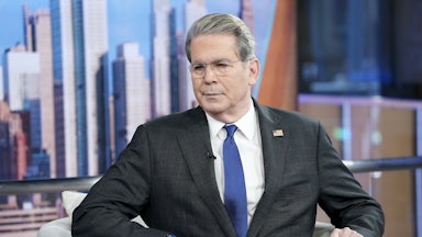 Treasury Secretary Scott Bessent sits in a chair at an interview.