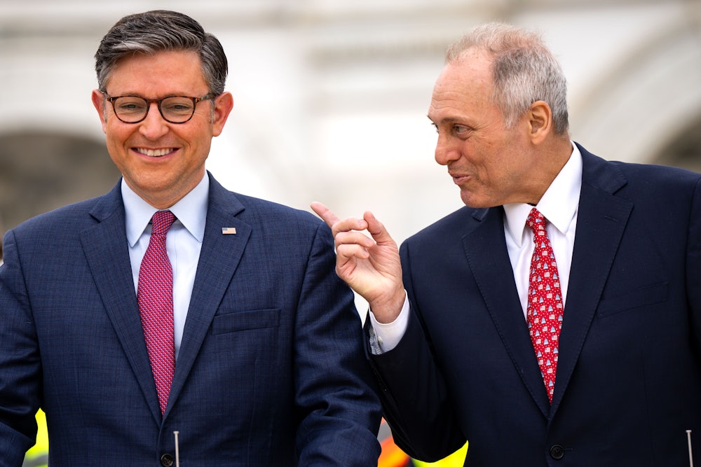 Mike Johnson smiles while Steve Scalise says something.