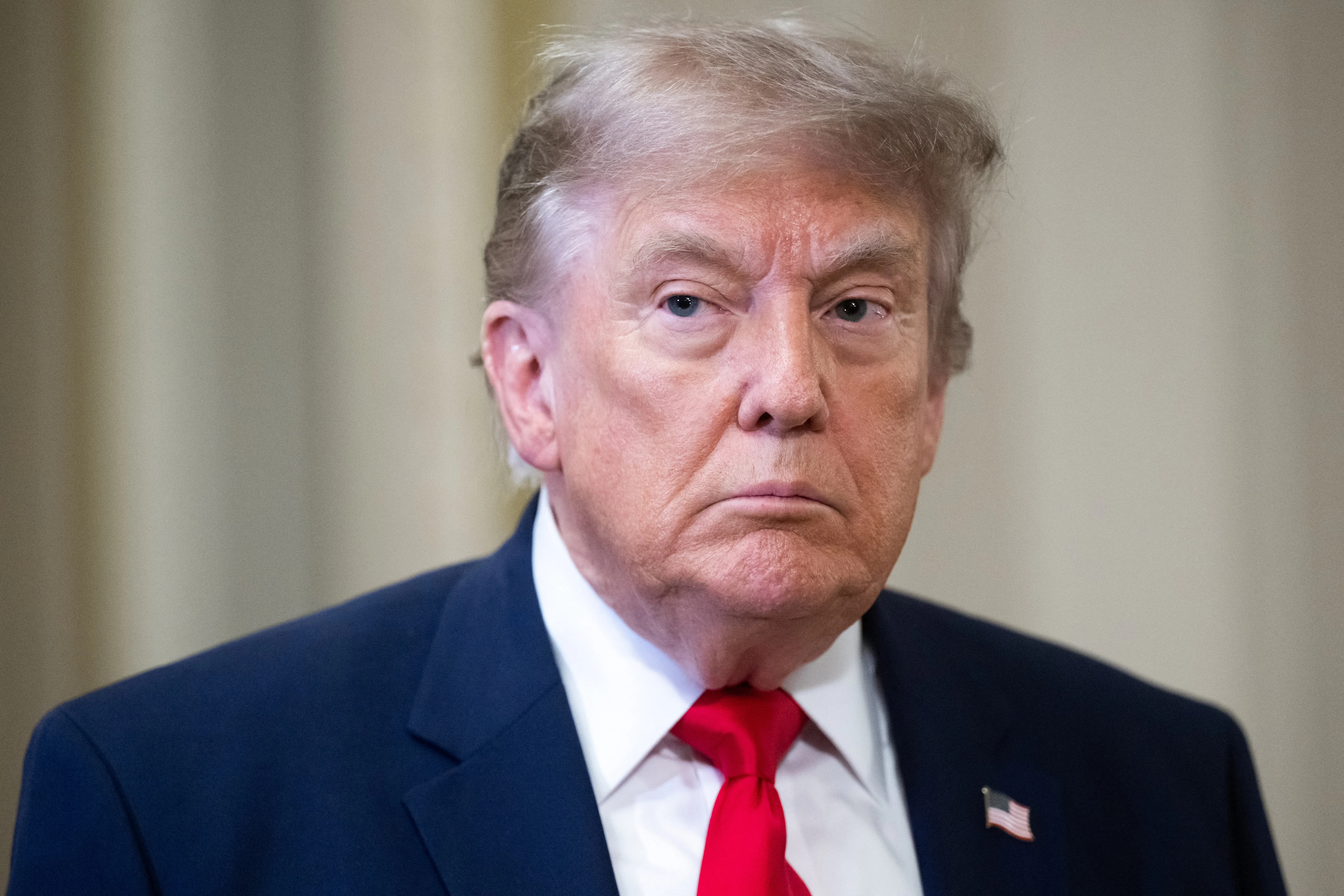 Donald Trump frowns and stares blankly