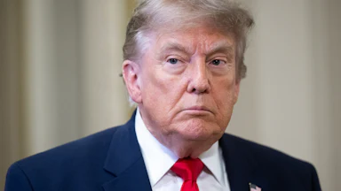 Donald Trump frowns and stares blankly