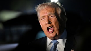 Donald Trump speaks to reporters before boarding Air Force One.