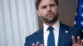 JD Vance speaking, puts his hands up as if in defense