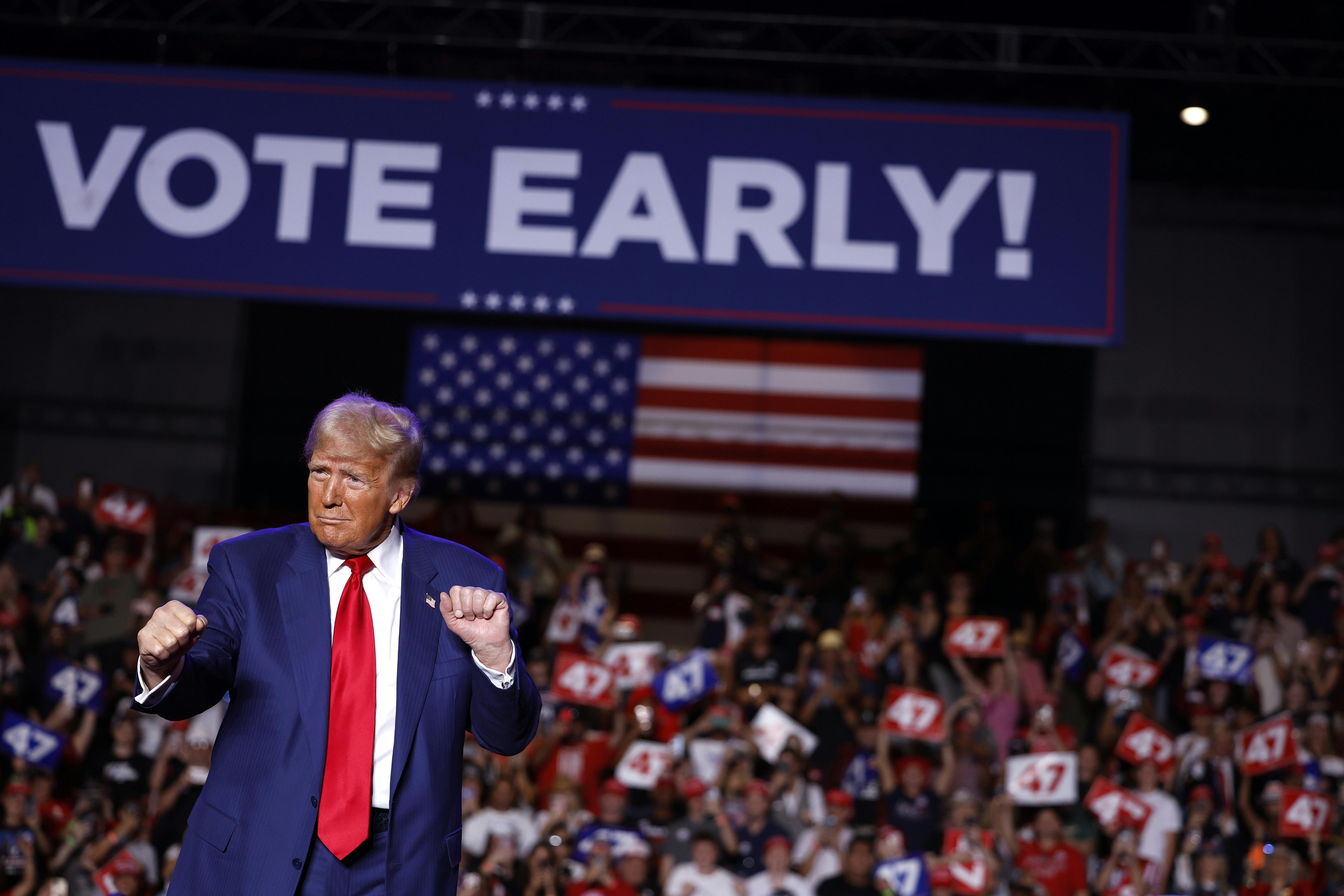 Trump in front of Vote Early sign