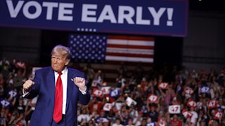 Trump in front of Vote Early sign