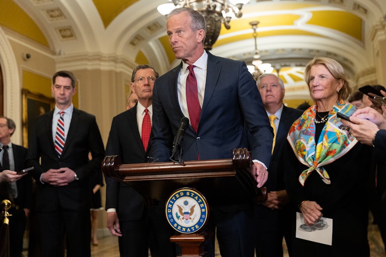 Senate Majority Leader John Thune stands at a podium during a Senate Republicans press conference