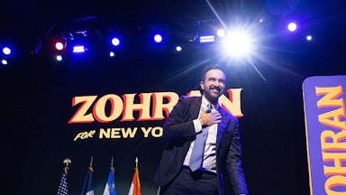 Zohran Mamdani on stage celebrating his election win.