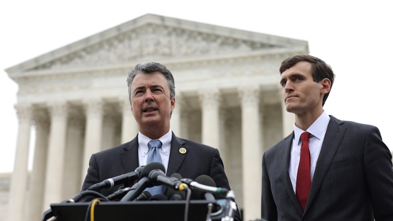 Steve Marshall speaks at a podium in front of the Supreme Court building.
